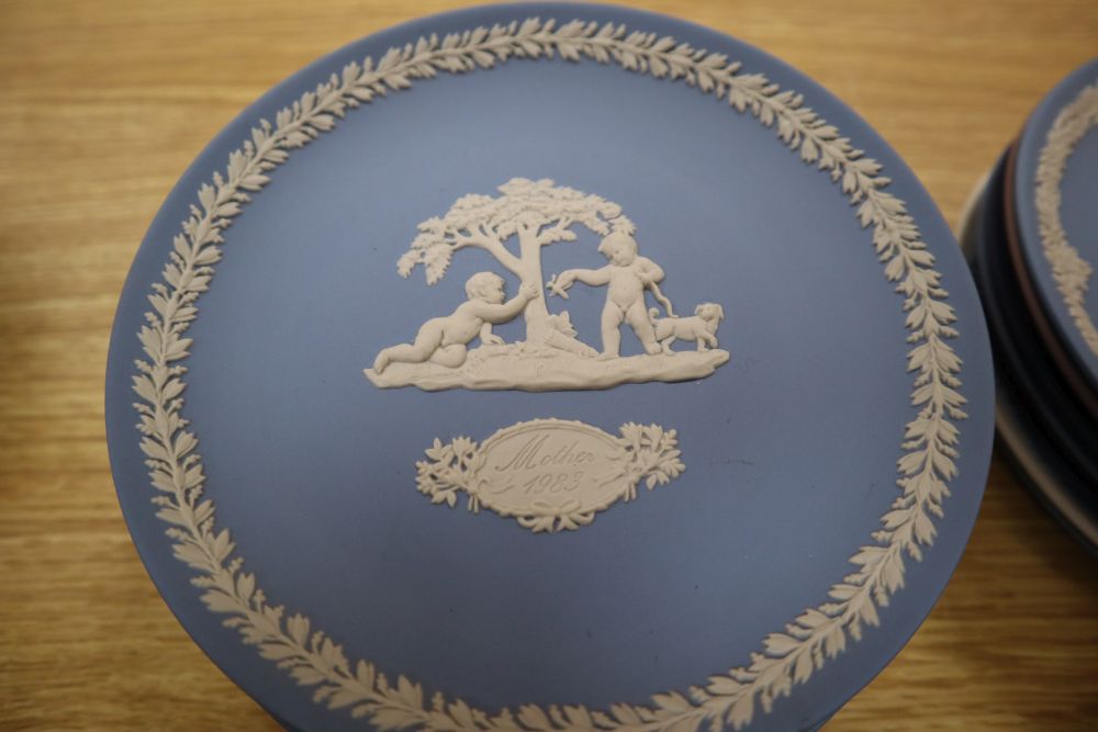 Sixteen Wedgwood jasper mother plates, ten Royal Copenhagen Christmas plates and twelve Limoges Paris view plates and a B & G plate